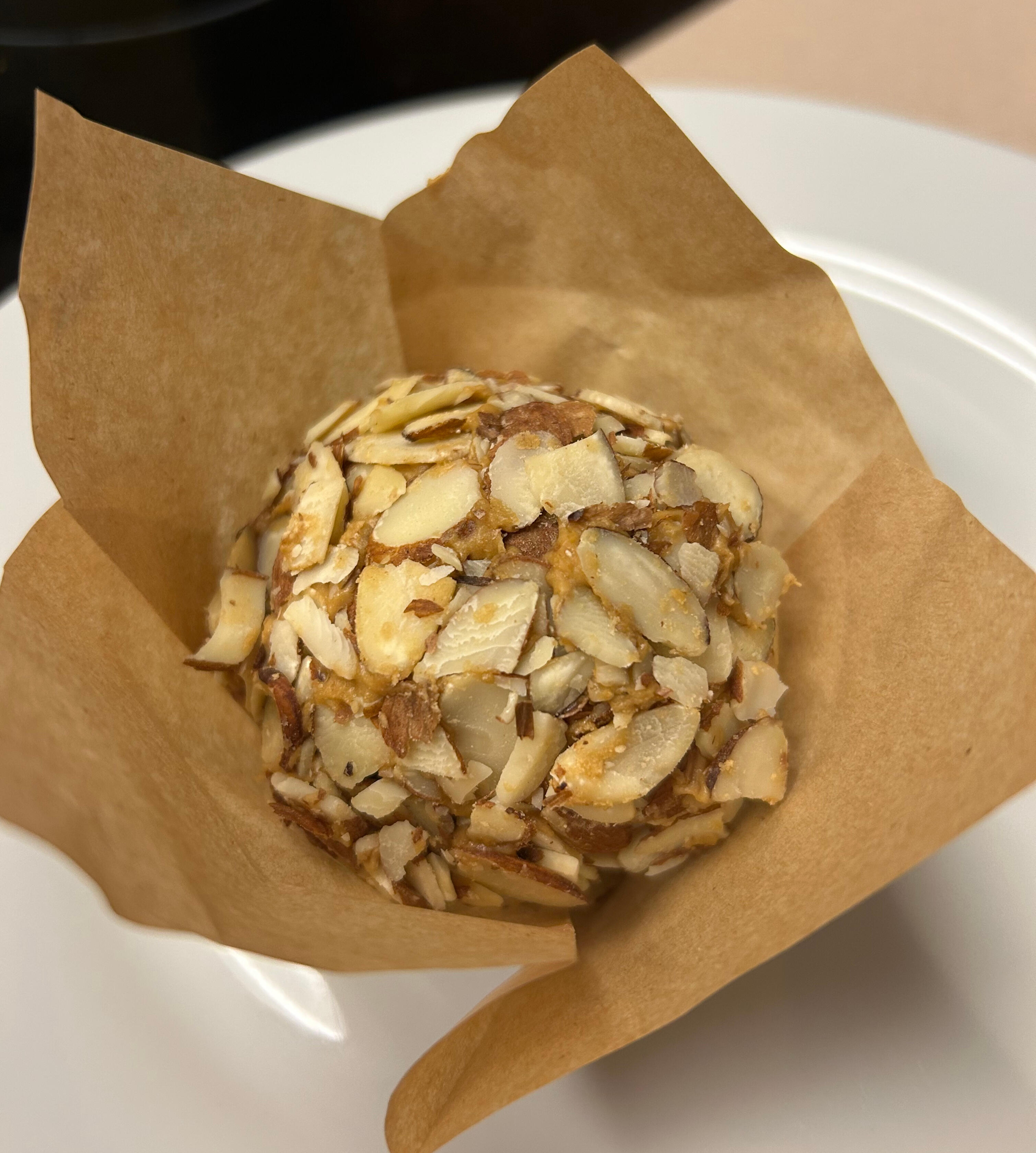 Angel food cake globe with coffee-buttercream and sliced almonds